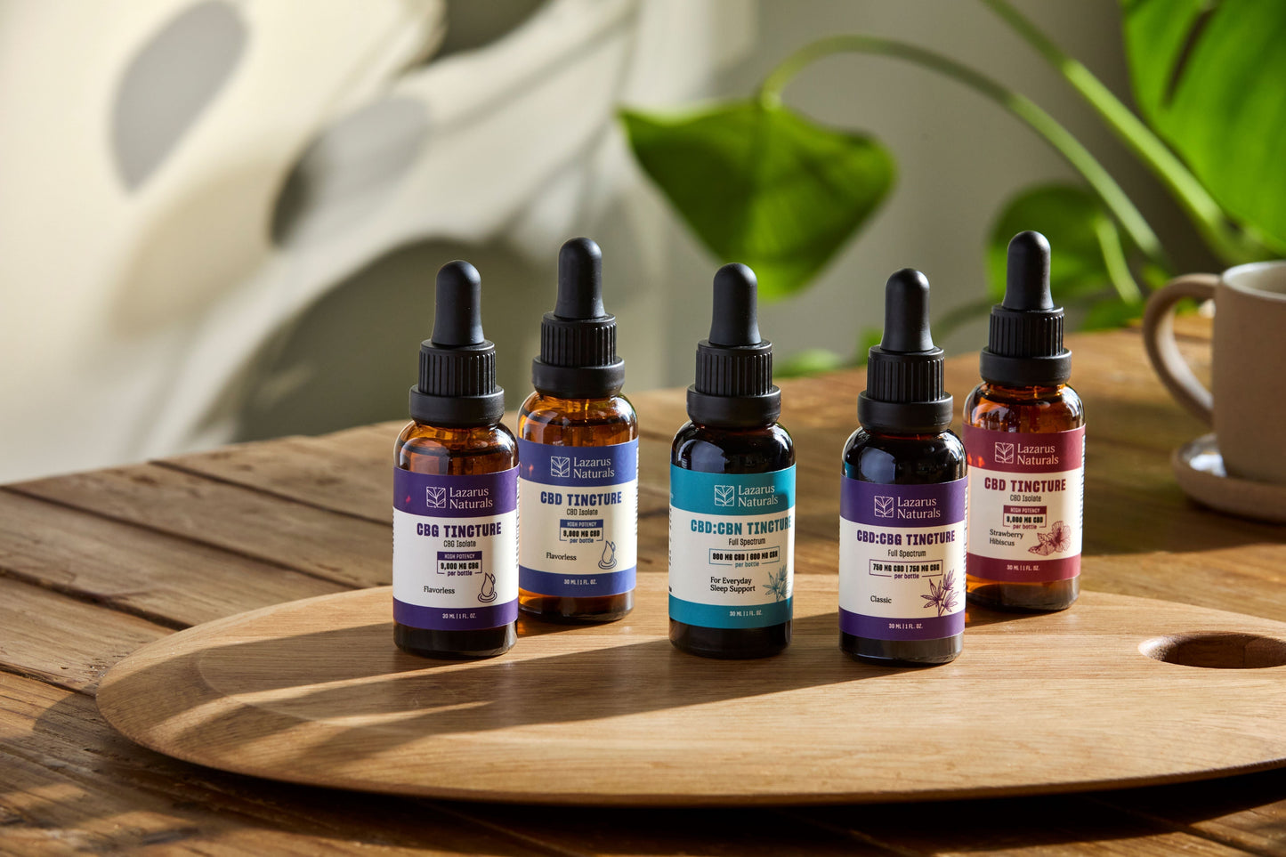 Lazarus Naturals Tinctures in order from left to right: CBG Flavorless, CBD Flavorless, CBD:CBN, CBG, and Strawberry Hibiscus 