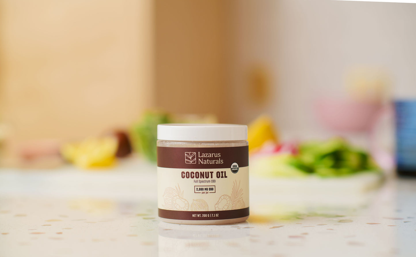 Lazarus Naturals CBD Coconut Oil on a kitchen counter