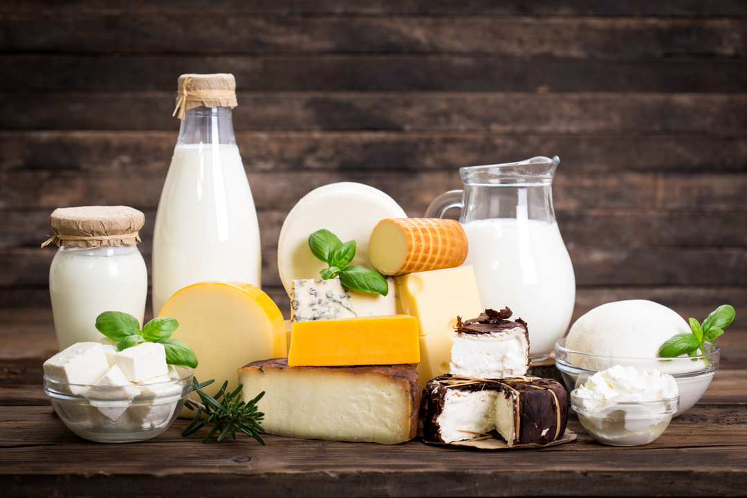 a photo of various milk, cheese, and dairy products